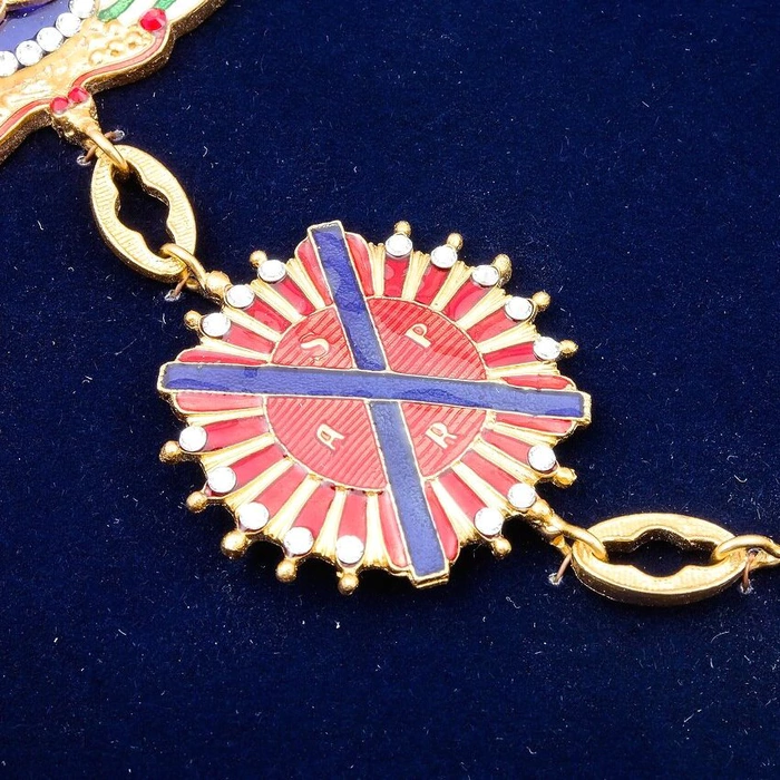 The Order of St. A. the First-Called on a chain with rhinestones under glass